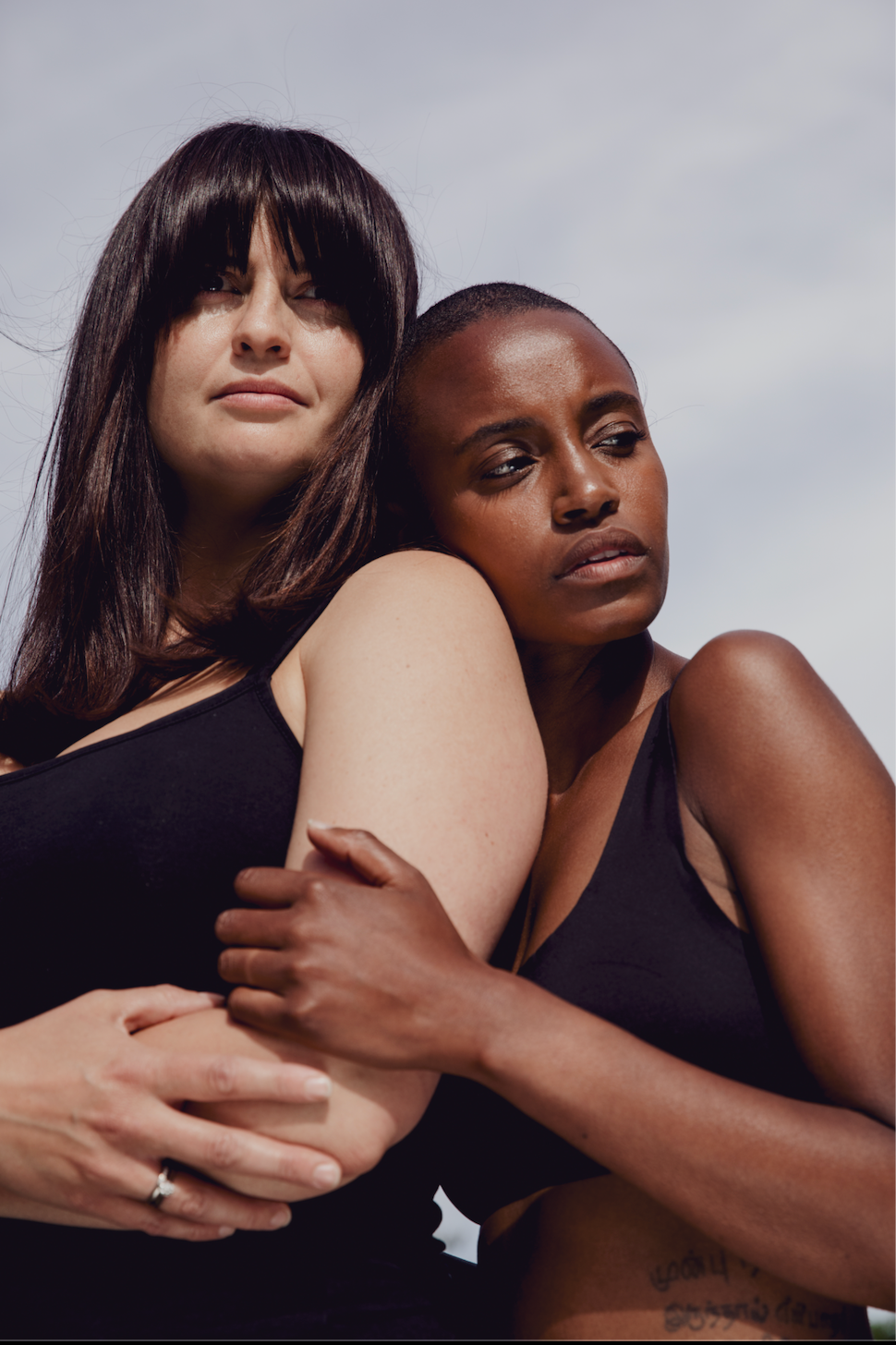 Two women embracing each other