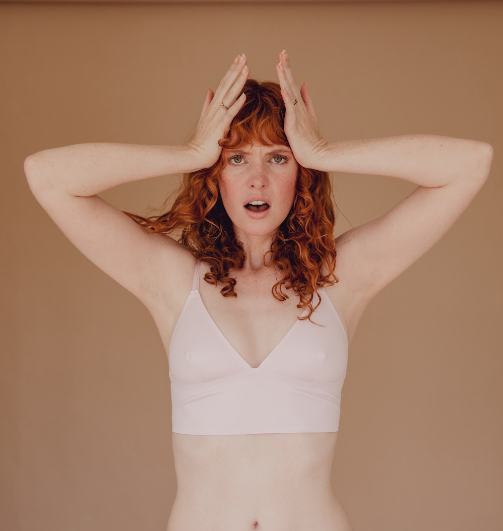 Woman expressing hormonal health challenges.